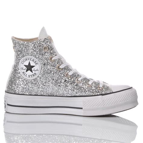 silver sparkly converse high tops.